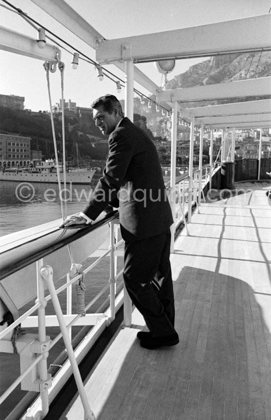 Cary Grant on board Onassis\' yacht Christina. Monaco harbor 1957. - Photo by Edward Quinn
