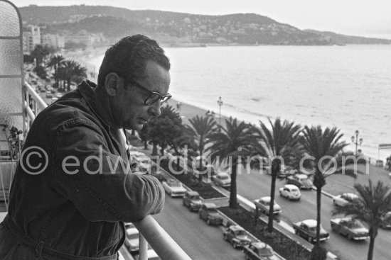 Hans Hartung looking down to the Promenade des Anglais from the balcony of his apartment in Nice 1961. - Photo by Edward Quinn