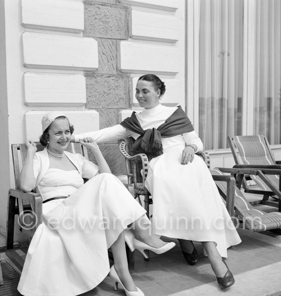 Olivia de Havilland and not yet identified lady. Cannes Film Festival 1953. - Photo by Edward Quinn
