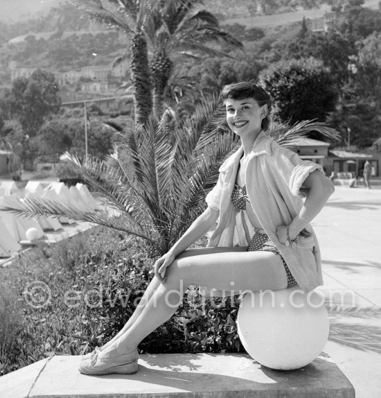 Audrey Hepburn in Monaco for the film "Monte Carlo Baby". She was at the beginning of her career and willingly posed for the photographer. Monte Carlo Beach 1951. - Photo by Edward Quinn