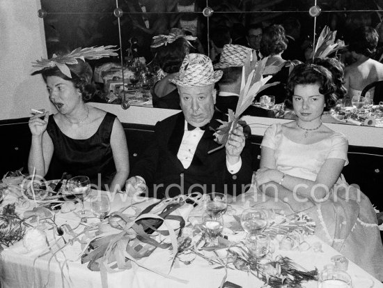 Alfred Hitchcock, his wife and his daughter. New Year Eve Gala Evening, Hotel Badrutt\'s Palace, St. Moritz 1961. - Photo by Edward Quinn