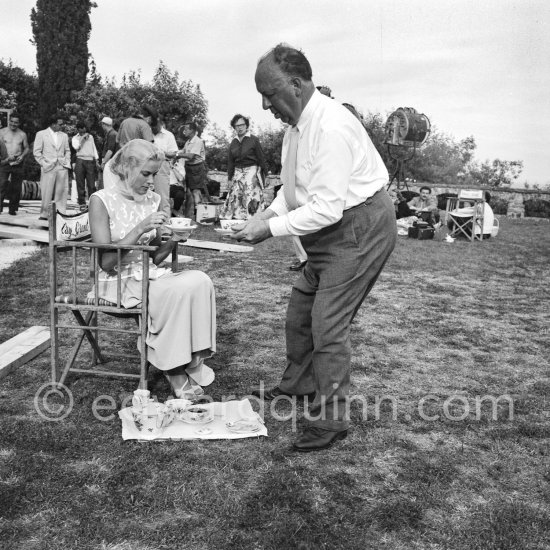 Grace Kelly and Alfred Hitchcock take afternoon tea on the set of "To Catch A Thief". Cannes 1954. - Photo by Edward Quinn
