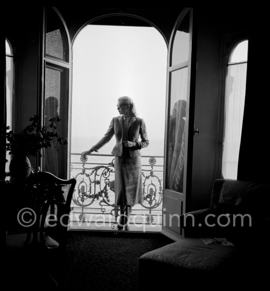 Grace Kelly on the balcony of her room at the Carlton Hotel. Cannes Film Festival 1955. - Photo by Edward Quinn