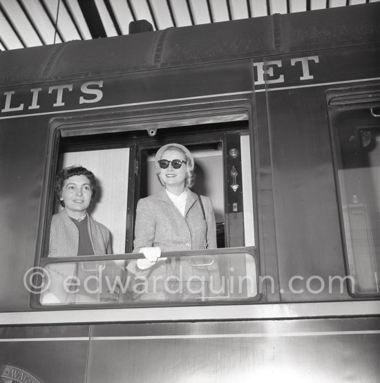 Grace Kelly arriving at Cannes station 1955. With her is her friend Gladys de Ségonzac, costume designer, who had helped her with the wardrobe on "To catch a thief". - Photo by Edward Quinn