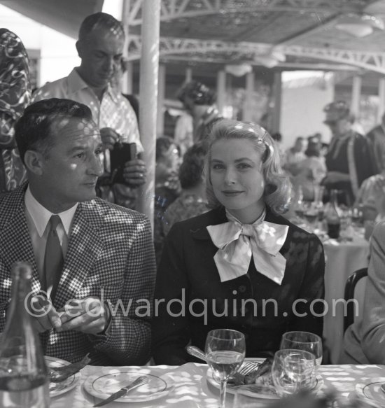 A cup of coffee for Grace Kelly at the Cannes Film Festival. On the left Rupert Allan. Cannes 1955. - Photo by Edward Quinn