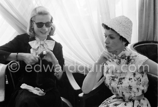 Grace Kelly photographs Françoise Arnoul with Leica IIIf Nr. 695 137 with Winder Leicavit of Edward Quinn, Cannes 1955. - Photo by Edward Quinn