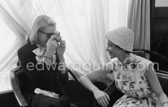 Grace Kelly photographs Françoise Arnoul with Leica IIIf Nr. 695 137 with Winder Leicavit of Edward Quinn, Cannes 1955. - Photo by Edward Quinn