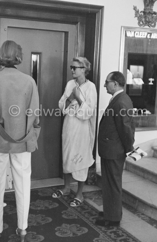 Grace Kelly in bathing robe after a swim with Jean-Pierre Aumont. Cannes Film Festival 1955. - Photo by Edward Quinn