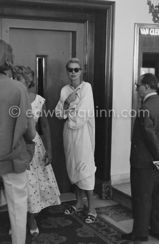 Grace Kelly in bathing robe after a swim with Jean-Pierre Aumont. Cannes Film Festival 1955. - Photo by Edward Quinn