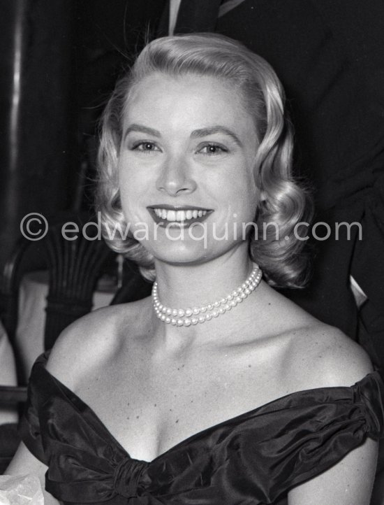 Grace Kelly. Elsa Maxwell, American gossip journalist in the background. Cannes Film Festival 1955. - Photo by Edward Quinn