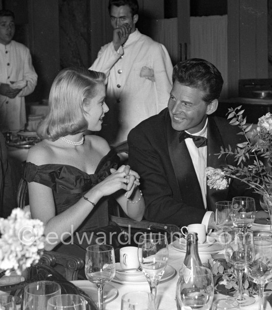 Grace Kelly and Jean-Pierre Aumont. They had a short affair. Cannes Film Festival 1955. Cartier Trinity ring - Photo by Edward Quinn