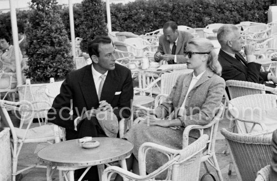 Grace Kelly and Gordon White, chairman of Hanson Industries, on the terrasse of the Carlton Hotel. Cannes Film Festival 1955. - Photo by Edward Quinn