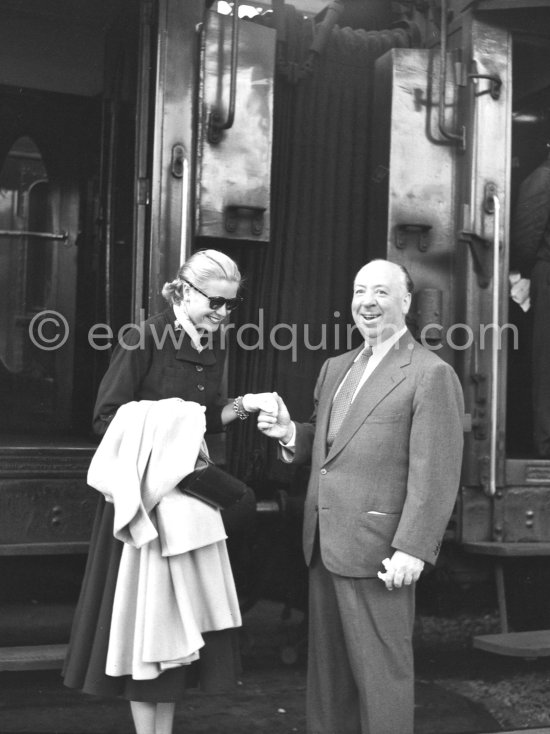 Grace Kelly arriving at the Cannes Railway Station, met by Alfred Hitchcock. It was the third time she was in Europe. In 1947 she came with the family, in 1949 on assignement, she was then a fashion model. Cannes 1954. - Photo by Edward Quinn