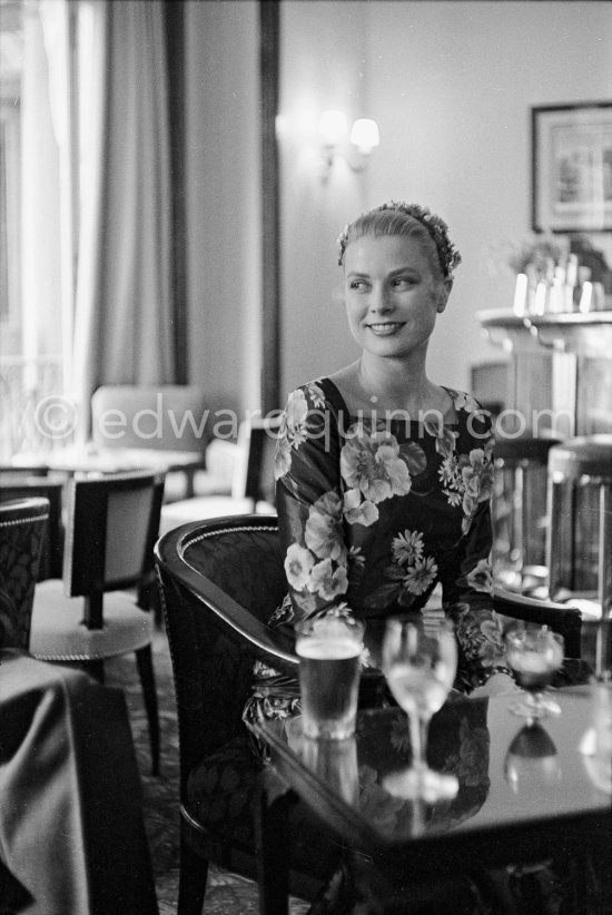 Grace Kelly (later to become Princess Grace) arriving a little early for her audience with Prince Rainier in Monte Carlo in 1955. As a routine part of her job, she went over to Monaco with the MGM representative to have pictures taken for a pubIicity spread in Paris-Match. She hadn’t had lunch, and appreciated time for a sandwich at the Hotel de Paris. - Photo by Edward Quinn