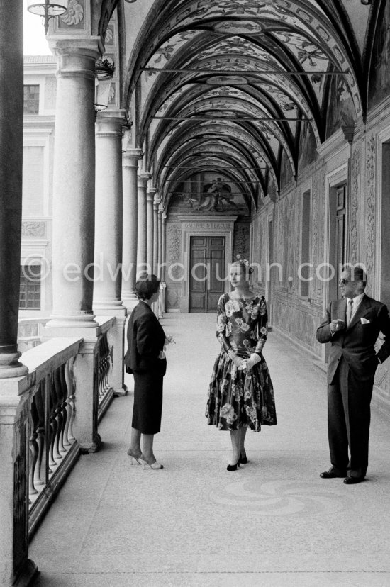 Grace Kelly (later to become Princess Grace) at the Royal Palace just before she met Prince Rainier for the first time. One of Prince Rainier’s personal servants, Michel Demorizi, guided her around some of the great number of rooms of the Royal Palace. With her is her friend Gladys de Ségonzac (left), costume designer, and Monsieur Lapinière, a MGM representative. Monaco 1955. - Photo by Edward Quinn