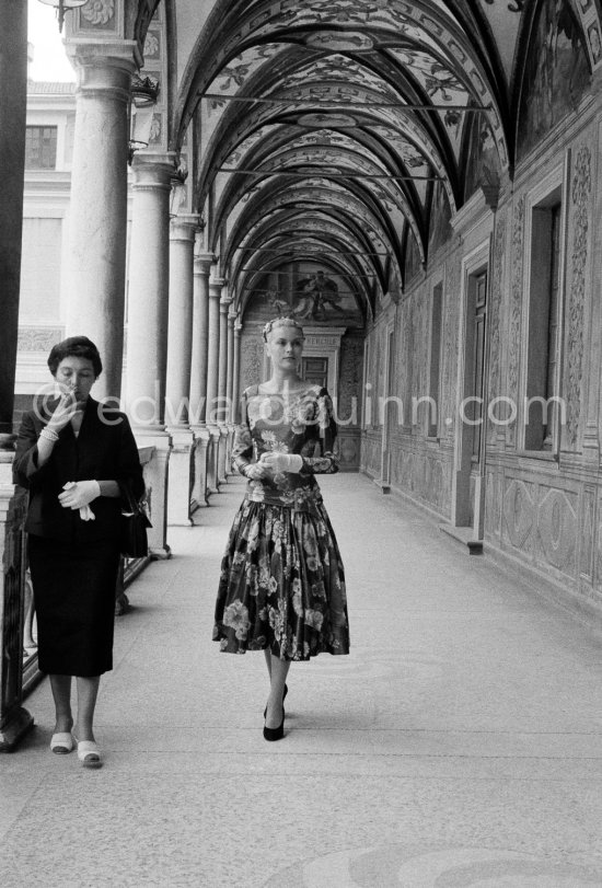 Grace Kelly (later to become Princess Grace) at the Royal Palace just before she met Prince Rainier for the first time. One of Prince Rainier’s personal servants, Michel Demorizi, guided her around some of the great number of rooms of the Royal Palace. With her is her friend Gladys de Ségonzac (left), costume designer, and Monsieur Lapinière, a MGM representative. Monaco 1955. - Photo by Edward Quinn