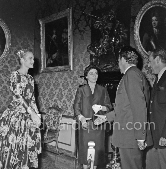 Prince Rainier III of Monaco meeting American film Star Grace Kelly (later to become Princess Grace) for the first time at his Monaco Palace in 1955. Here he greets her friend Gladys de Ségonzac, costume designer. - Photo by Edward Quinn