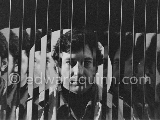 Argentine kinetic and Op artist Julio Le Parc behind one of his works at the Gallery Denise René rive gauche. Exhibition "L’idée et la matière", Paris 1974. - Photo by Edward Quinn