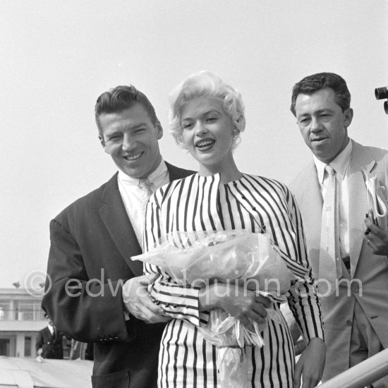 When Jayne Mansfield came to the Cannes Film Festival in 1958., she had just married Mickey Hargitay, the ex-muscle man in Mae West’s nightclub act and former Mr. Universe. From the moment of her arrival at Nice Airport, Jayne had to fight her way through a crowd of fans and journalists. Nice Airport 1958. - Photo by Edward Quinn