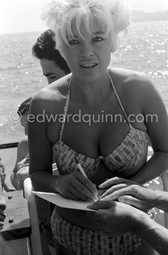 Jane Mansfield, signing autographs, on a return trip to the Cannes Film Festival 1964. - Photo by Edward Quinn