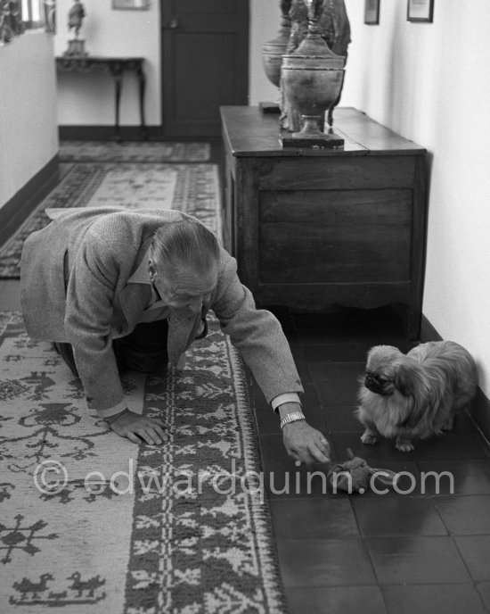 Somerset Maugham plays with Chin, one of his two Pekingese, at his Villa Mauresque. Saint-Jean-Cap-Ferrat 1954. - Photo by Edward Quinn
