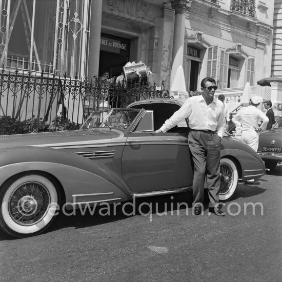 Robert Mitchum, during filming of "Foreign Intrigue". Cannes 1955. Car: 1948 Talbot-Lago T26 Record convertible coachwork by Henri Chapron - Photo by Edward Quinn