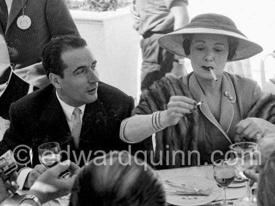Edwige Feuillère and François Mitterrand at lunch during the Cannes Film Festival 1956. - Photo by Edward Quinn