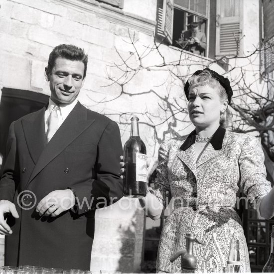 Simone Signoret, French actress often hailed as one of France’s greatest movie stars, on her wedding in 1951 to actor and singer Yves Montand. Preparing an apéitif at the same restaurant Colombe d’Or, Saint-Paul-de-Vence, where their romance began. - Photo by Edward Quinn