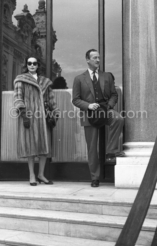David Niven and his Swedish wife Hjordis Tersmeden waiting in front of Hotel de Paris. Monte Carlo 1959. - Photo by Edward Quinn