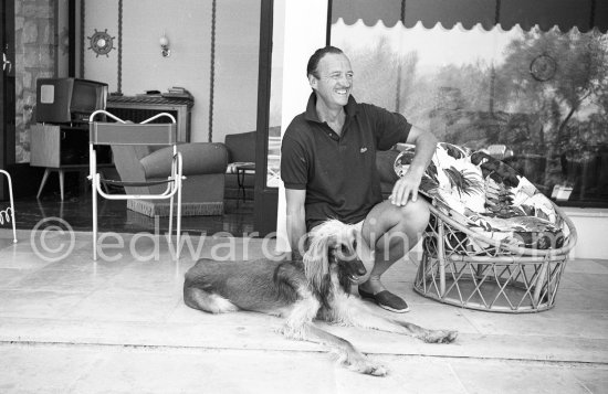 David Niven and his Afghan Hound on the patio at his mansion. Saint-Jean-Cap-Ferrat 1961 - Photo by Edward Quinn