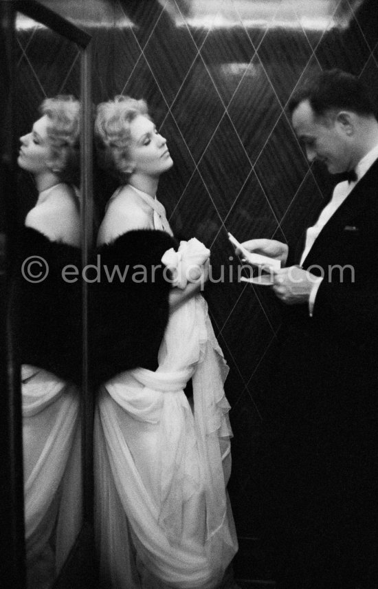 Kim Novak, with Rupert Allan of LOOK Magazine, In the lift of the Carlton Hotel, Cannes 1956. - Photo by Edward Quinn