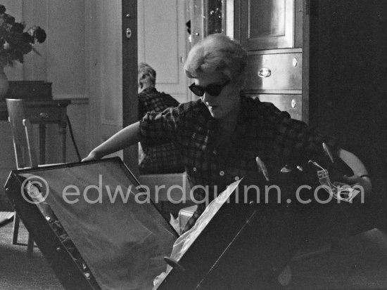 Kim Novak packs one of her numerous suitcases at the Hotel Carlton, Cannes 1956. - Photo by Edward Quinn