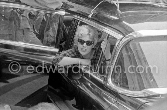Kim Novak’s departure. The Cannes Film Festival being finished, she Is leaving for Italy. Carlton Hotel Cannes 1956. Car: 1954 or 1955 Cadillac Series 75 Fleetwood Sedan or Limousine. - Photo by Edward Quinn