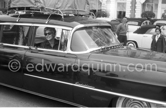 Kim Novak’s departure. Carlton Hotel Cannes 1956. Car: 1954 or 55 Cadillac Series 75 Fleetwood Sedan or Limousine. - Photo by Edward Quinn