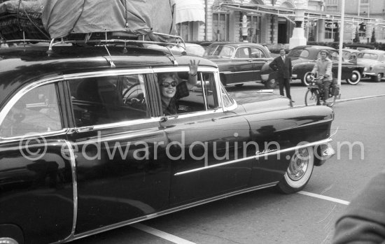 Kim Novak’s departure. Carlton Hotel Cannes 1956. Car: 1954 or 55 Cadillac Series 75 Fleetwood Sedan or Limousine. - Photo by Edward Quinn
