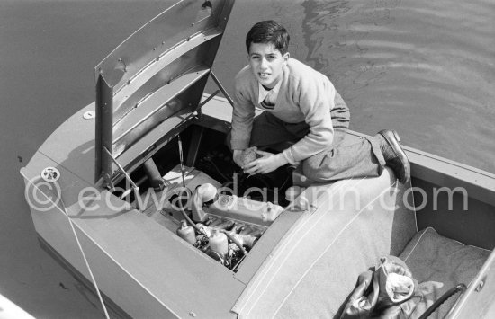 Alexander Onassis on the tender boat of yacht Christina. Monaco harbor 1957. - Photo by Edward Quinn