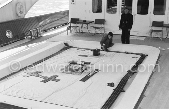 Alexander Onassis playing with his slot cars in the pool on board Onassis\' yacht Christina. Monaco harbor 1957. - Photo by Edward Quinn