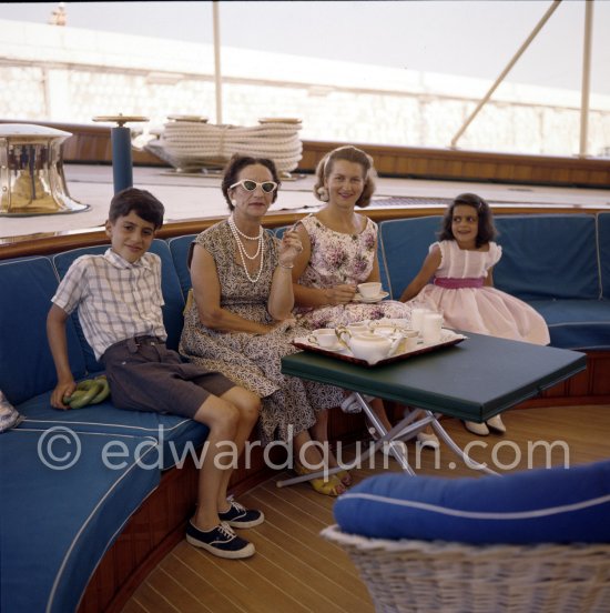 Aristotle and Tina Onassis\' children Alexander and Christina on board Onassis\' yacht Christina. Two not yet identified ladies. Monaco harbor 1957. - Photo by Edward Quinn