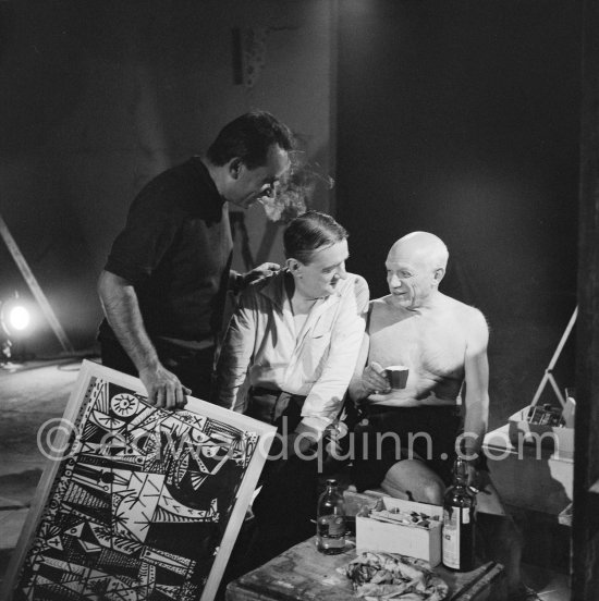 The background music of the Clouzot/Pablo Picasso film is by one of their old friends Georges Auric who has become very well-known for his music from "Moulin rouge". Here he is seen with Clouzot and Pablo Picasso on the film set of "Le mystère Picasso", Nice, Studios de la Victorine 1955. - Photo by Edward Quinn