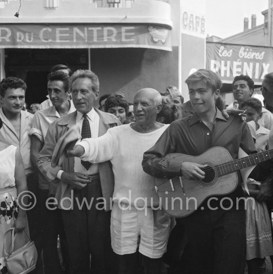 Pablo Picasso and Jean Cocteau on the way to the corrida put on in Pablo Picasso\'s honor. On the right the son of the writer José Herrera-Petere. Vallauris 1955. - Photo by Edward Quinn