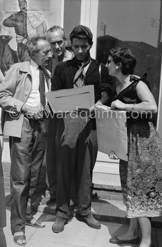 Jean Cocteau, his adopted son Edouard Dermit and photographer Jacques-Henri with a not yet identified lady. Vallauris 1955. - Photo by Edward Quinn