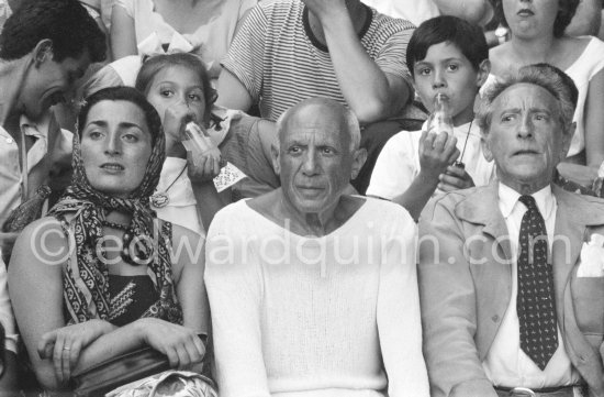 On the grandstand of a bullfight put on in Pablo Picasso\'s honor. From left: Jacqueline, Pablo Picasso, Jean Cocteau. Behind them Paloma Picasso and Claude Picasso. Vallauris 1955. - Photo by Edward Quinn