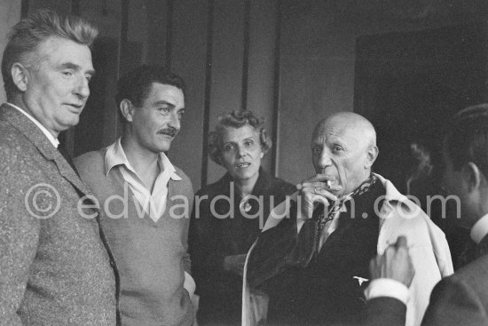 Edouard Pignon, not yet identified person, Suzanne Ramié (with a pendent by Picasso), Pablo Picasso. On the occasion of Picasso\'s 75th birthday on 25.10. Exhibition at Madoura? Vallauris 1956. - Photo by Edward Quinn