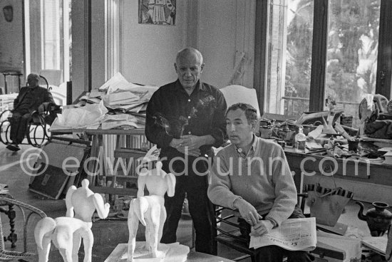 Pablo Picasso and French painter and writer André Verdet, examinig two plasters of "Centaure". Jaime Sabartés in the background. La Californie, Cannes 1956. - Photo by Edward Quinn