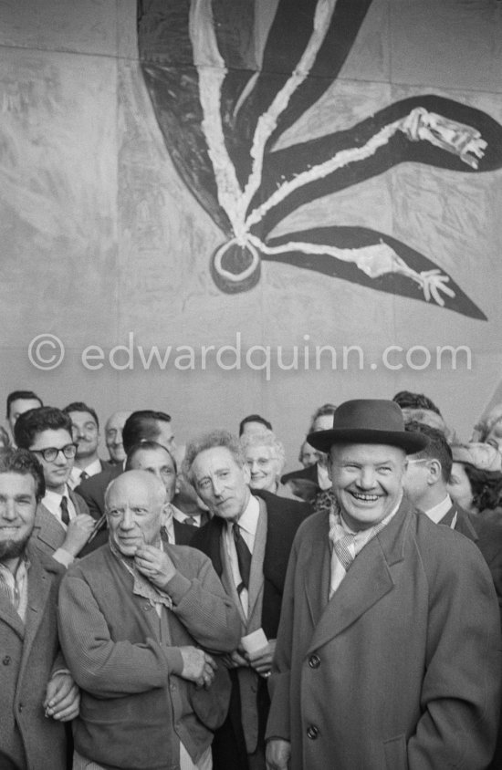 Pablo Picasso, Jean Cocteau and Maurice Thorez, leader of the French Communist Party (PCF). Unveiling of mural "The Fall of Icarus" ("La chute d\'Icare") for the conference hall of UNESCO building in Paris. The mural is made up of forty wooden panels. Initially titled "The Forces of Life and the Spirit Triumphing over Evil", the composition was renamed in 1958 by George Salles, who preferred the current title, "The Fall of Icarus" ("La chute d\'Icare"). Vallauris, 29 March 1958. - Photo by Edward Quinn