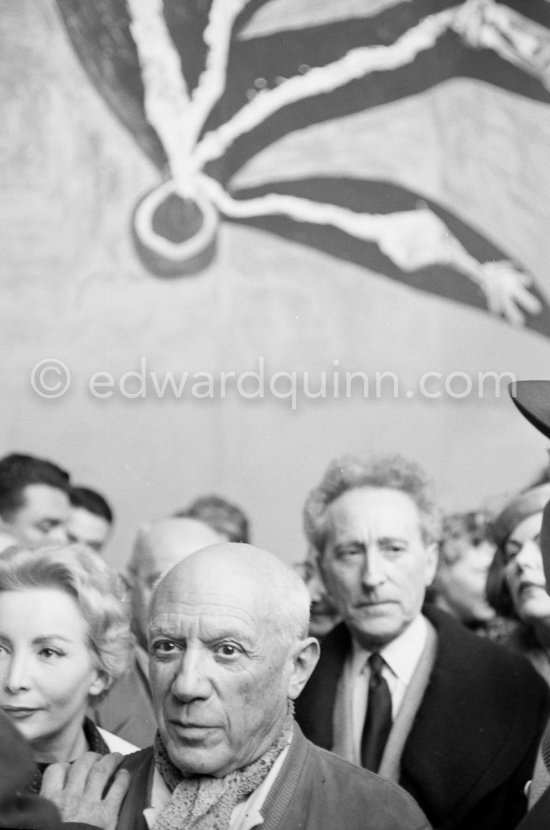 Pablo Picasso and Jean Cocteau. Unveiling of mural "The Fall of Icarus" ("La chute d\'Icare") for the conference hall of UNESCO building in Paris. The mural is made up of forty wooden panels. Initially titled "The Forces of Life and the Spirit Triumphing over Evil", the composition was renamed in 1958 by George Salles, who preferred the current title, "The Fall of Icarus" ("La chute d\'Icare"). Vallauris, 29 March 1958. - Photo by Edward Quinn