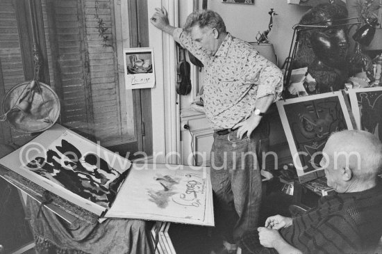 Pablo Picasso showing an India ink bullfight drawing to Edouard Pignon. La Californie, Cannes 1959. - Photo by Edward Quinn