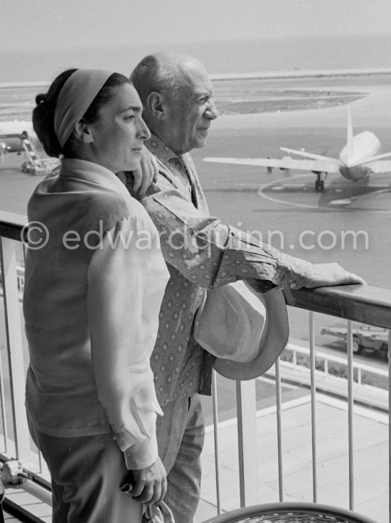 From a terrace at Nice Airport Pablo Picasso and Jacqueline watch for the arrival of the Leiris and the Lascaux from Paris. Nice Airport 1960. - Photo by Edward Quinn