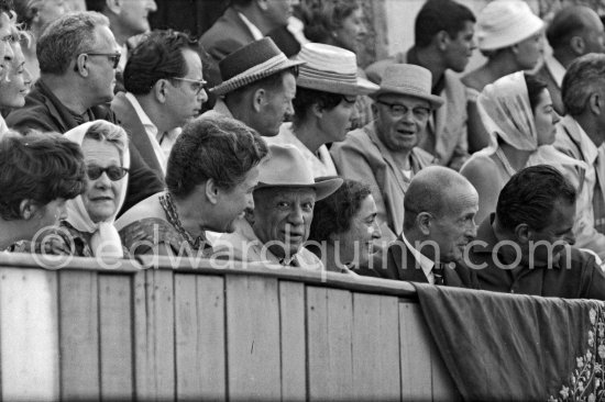 Pablo Picasso with Jacqueline at the the bullfight, on the left of her Michel Leiris, on the right of Pablo Picasso Anna Maria Torra Amat, wife of Spanish publisher Gustavo Gili and Marie Cuttoli. Second row left Douglas Cooper. Arles 1960. - Photo by Edward Quinn
