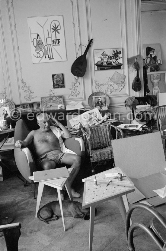 Pablo Picasso with dachshund Lump. A Ripolin can behind him. La Californie, Cannes 1961. - Photo by Edward Quinn